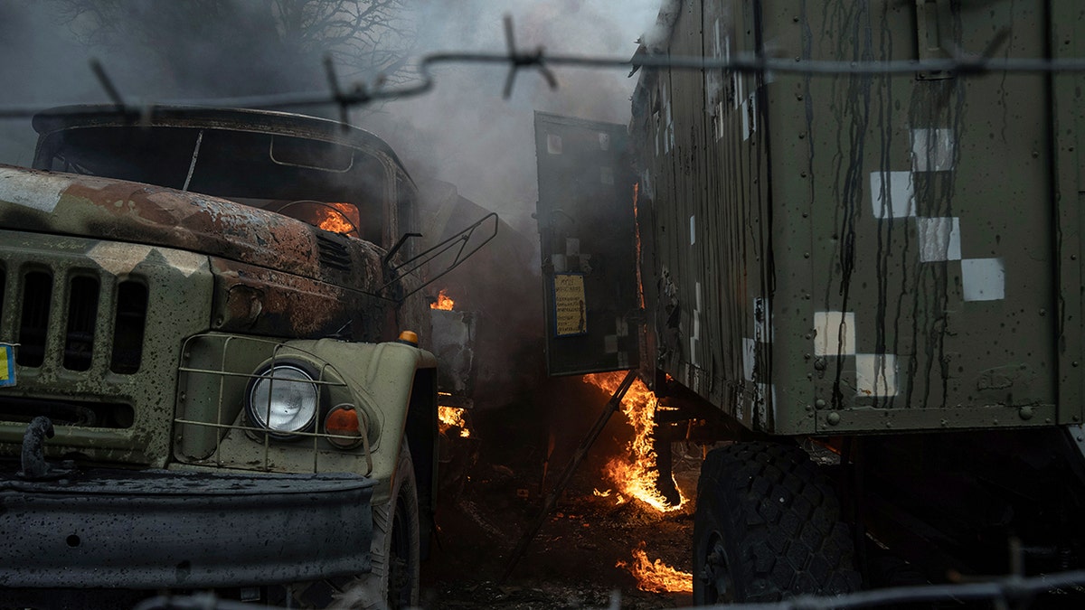Ukrainian military track burns at an air defence base in the aftermath of an apparent Russian strike in Mariupol, Ukraine, Thursday, Feb. 24, 2022. Russian troops have launched their anticipated attack on Ukraine.