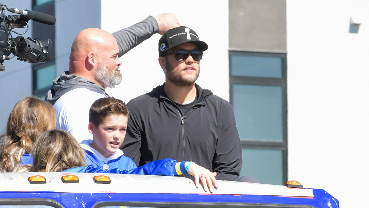 From the left, Andrew Whitworth and Matthew Stafford are seen at the Los Angeles Rams Super Bowl LVI Victory Parade and Rally on February 16, 2022 in Los Angeles. (Photo by Rodin Eckenroth/Getty Images)