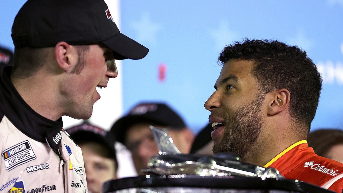 Austin Cindric, driver of the #2 Discount Tire Ford, is congratulated by Bubba Wallace, driver of the #23 McDonald's Toyota, in victory lane after winning the NASCAR Cup Series 64th Annual Daytona 500 at Daytona International Speedway on Feb. 20, 2022, in Daytona Beach, Florida.