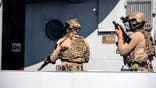 Cypriot Navy special forces and US Navy SEALS take part in a joint US-Cyprus rescue exercise in the port of the southern Cypriot port city of Limassol on September 10, 2021. (Photo by Iakovos Hatzistavrou / AFP) (Photo by IAKOVOS HATZISTAVROU/AFP via Getty Images)
