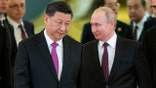 FILE - Chinese President Xi Jinping and Russian President Vladimir Putin enter a hall for talks in the Kremlin in Moscow, Russia, June 5, 2019.