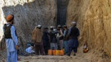 Rescuers try to reach and rescue a  boy trapped for two days down a well in a remote southern Afghan village of Shokak, in Zabul province about 120 Kms from Kandahar on February 17, 2022. (Photo by Javed TANVEER / AFP) (Photo by JAVED TANVEER/AFP via Getty Images)