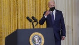 U.S. President Joe Biden removes his protective mask while arriving to speak in the East Room of the White House in Washington, D.C., U.S., on Thursday, Aug. 26, 2021. Two explosions outside Kabul's international airport killed 12 U.S. service members, along with at least 13 Afghans, with dozens more wounded less than a week before U.S. forces are due to depart. Photographer: Al Drago/Bloomberg via Getty Images