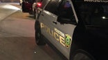 Officials say the robbery suspect who fled the scene is still on the loose.