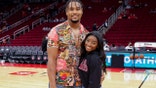 HOUSTON, TEXAS - DECEMBER 28: Simone Biles and Jonathan Owens attend a game between the Houston Rockets and the Los Angeles Lakers at Toyota Center on December 28, 2021 in Houston, Texas. NOTE TO USER: User expressly acknowledges and agrees that, by downloading and or using this photograph, User is consenting to the terms and conditions of the Getty Images License Agreement. (Photo by Carmen Mandato/Getty Images)
