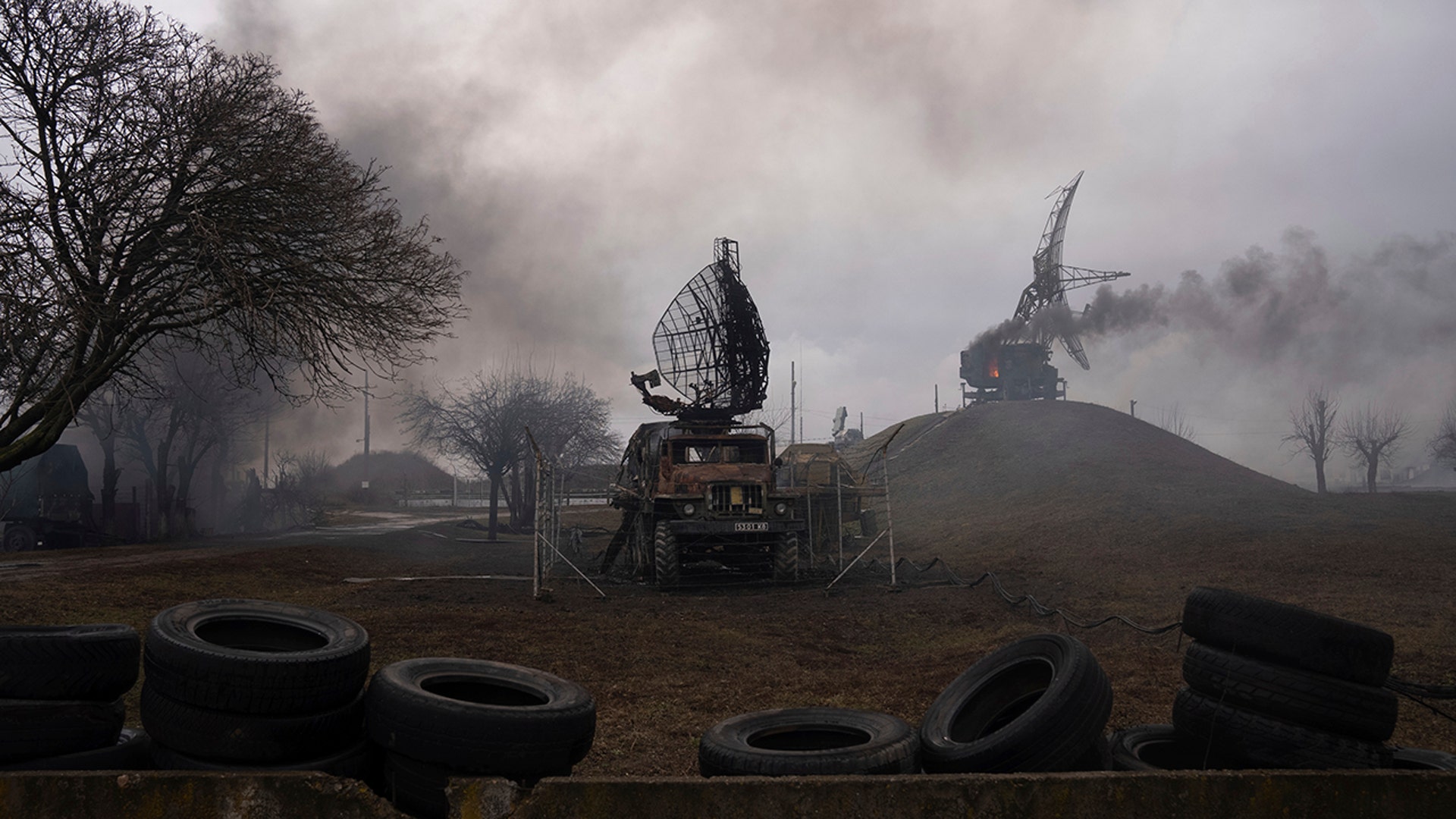 Smoke rise from an air defence base in the aftermath of an apparent Russian strike in Mariupol, Ukraine, Thursday, Feb. 24, 2022. Russian troops have launched their anticipated attack on Ukraine. Big explosions were heard before dawn in Kyiv, Kharkiv and Odesa as world leaders decried the start of Russian invasion that could cause massive casualties and topple Ukraine's democratically elected government. (AP Photo/Evgeniy Maloletka)