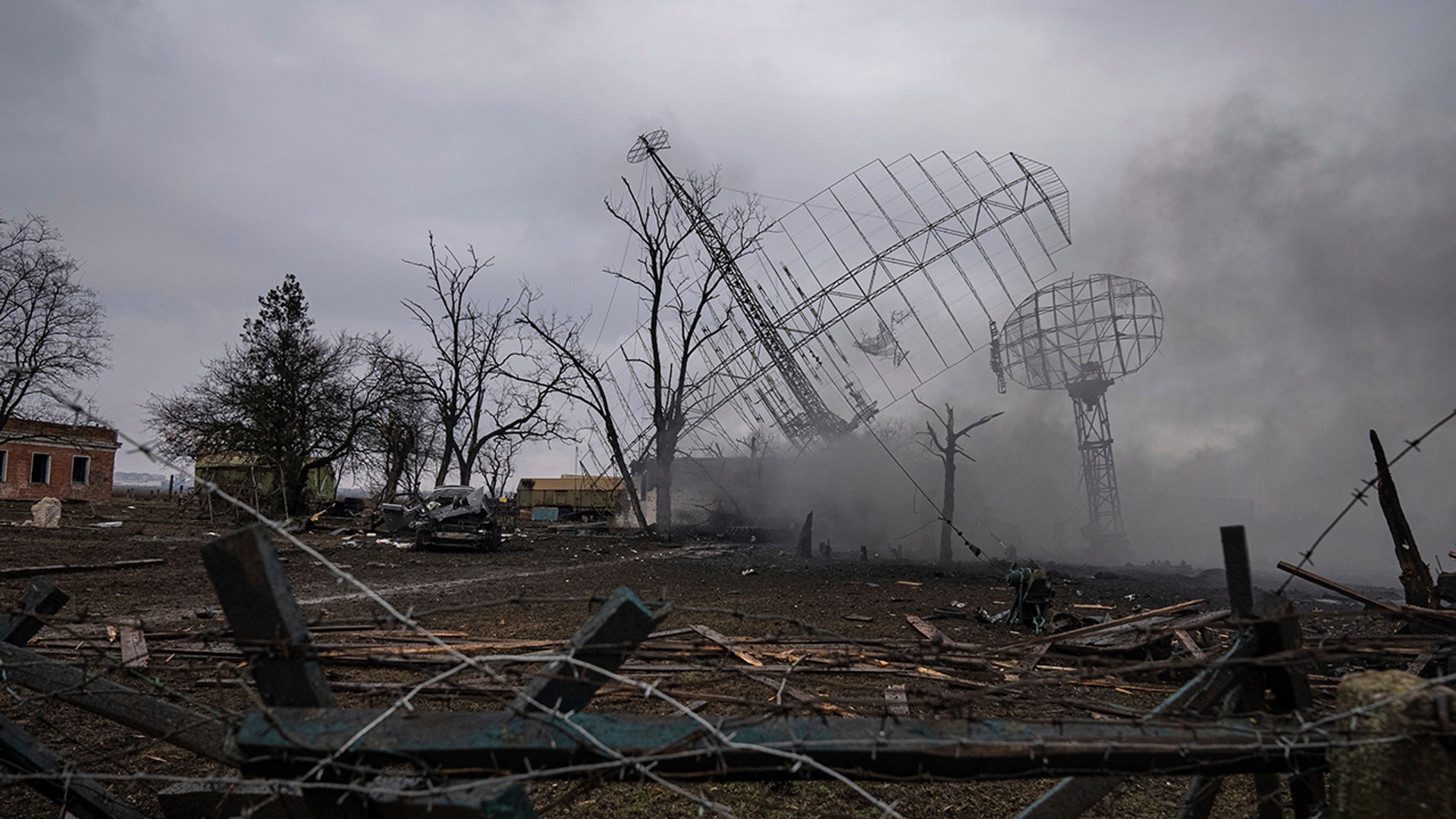 Smoke rise from an air defence base in the aftermath of an apparent Russian strike in Mariupol, Ukraine, Thursday, Feb. 24, 2022. Russian troops have launched their anticipated attack on Ukraine. Big explosions were heard before dawn in Kyiv, Kharkiv and Odesa as world leaders decried the start of Russian invasion that could cause massive casualties and topple Ukraine's democratically elected government. (AP Photo/Evgeniy Maloletka)