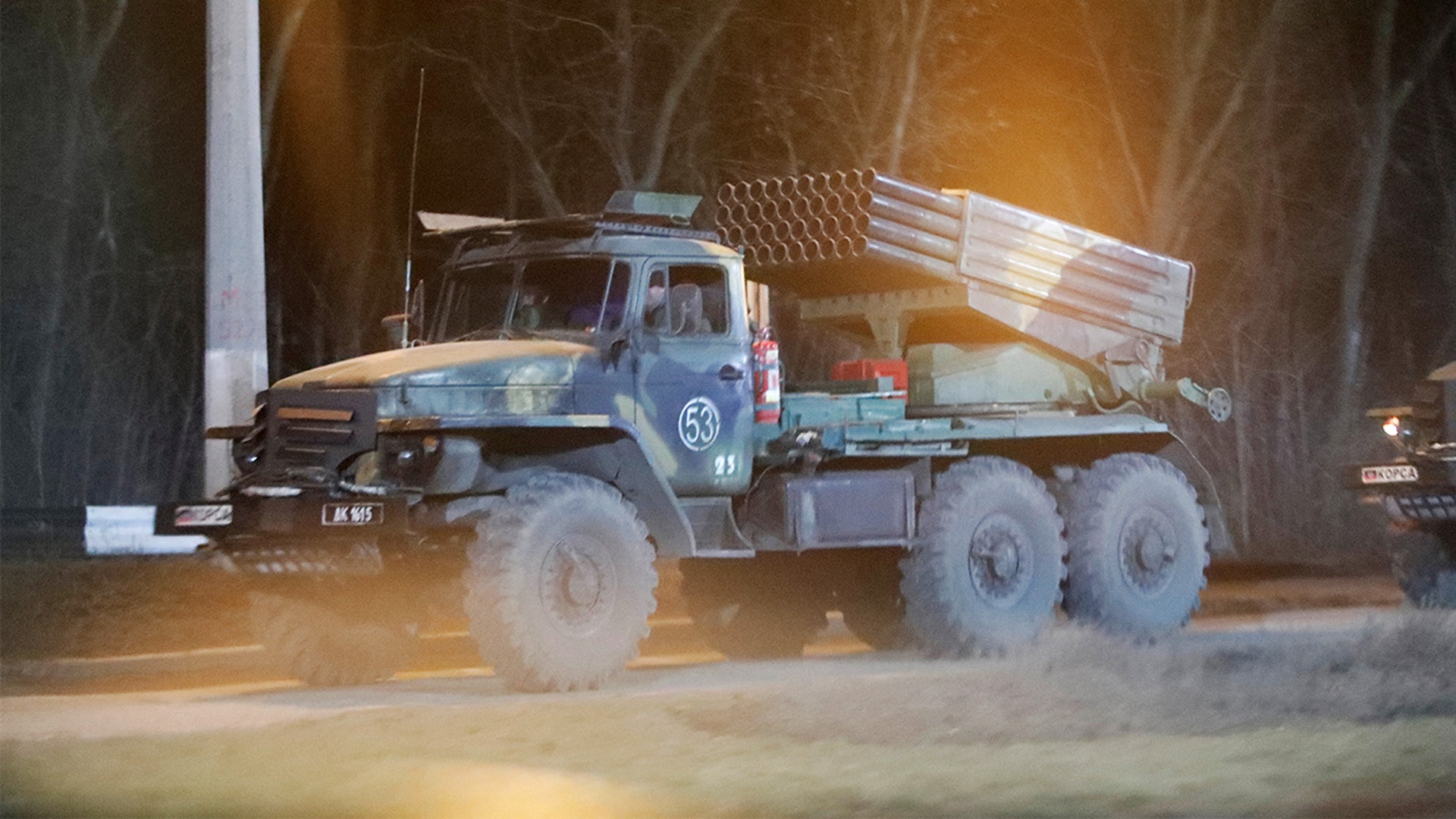 A military vehicle is seen on a street on the outskirts of the separatist-controlled city of Donetsk, Ukraine February 23, 2022.