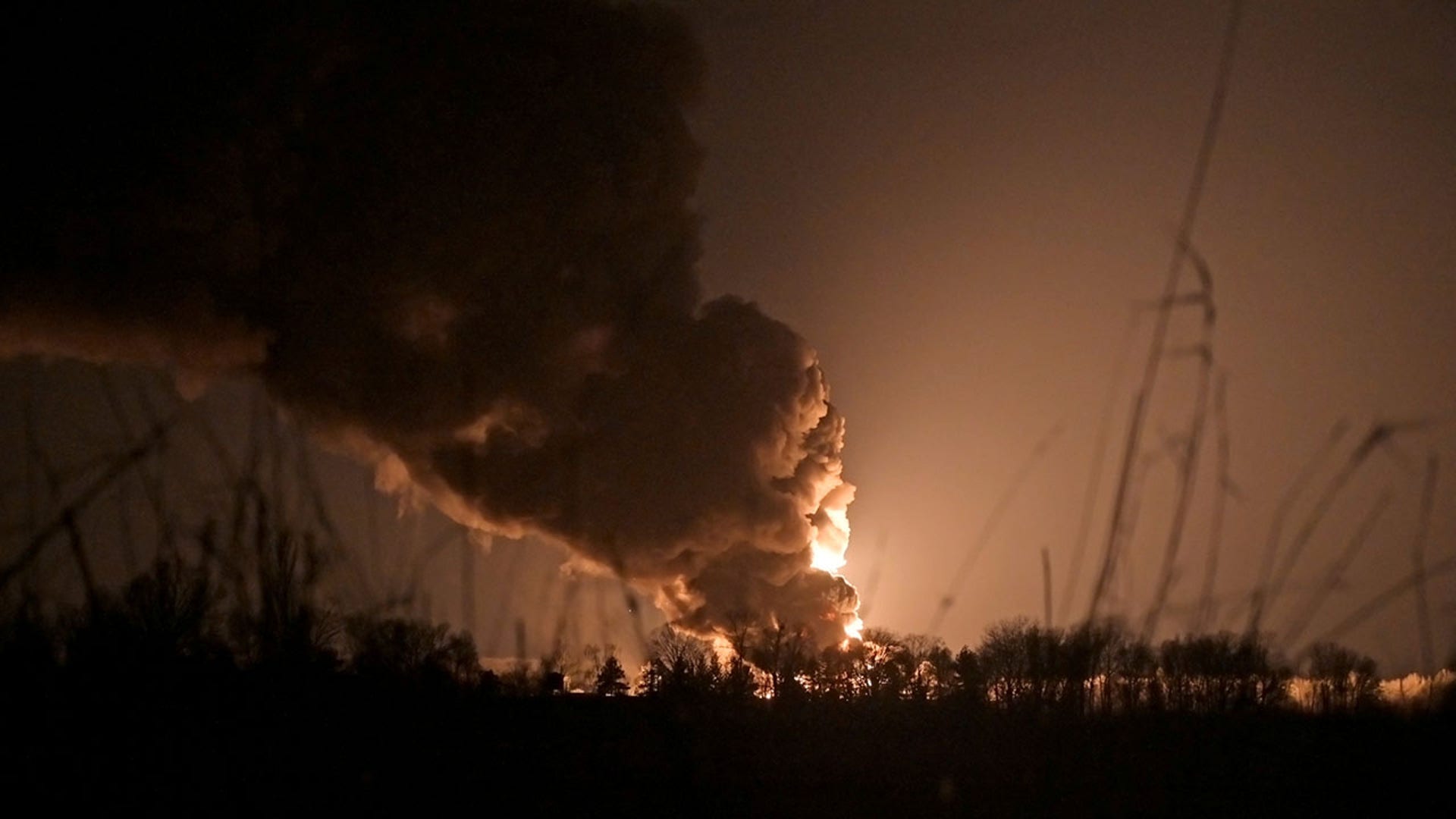 A view shows a burning oil depot reportedly hit by shelling near the military airbase Vasylkiv in the Kyiv region, Ukraine February 27, 2022. REUTERS/Maksim Levin
