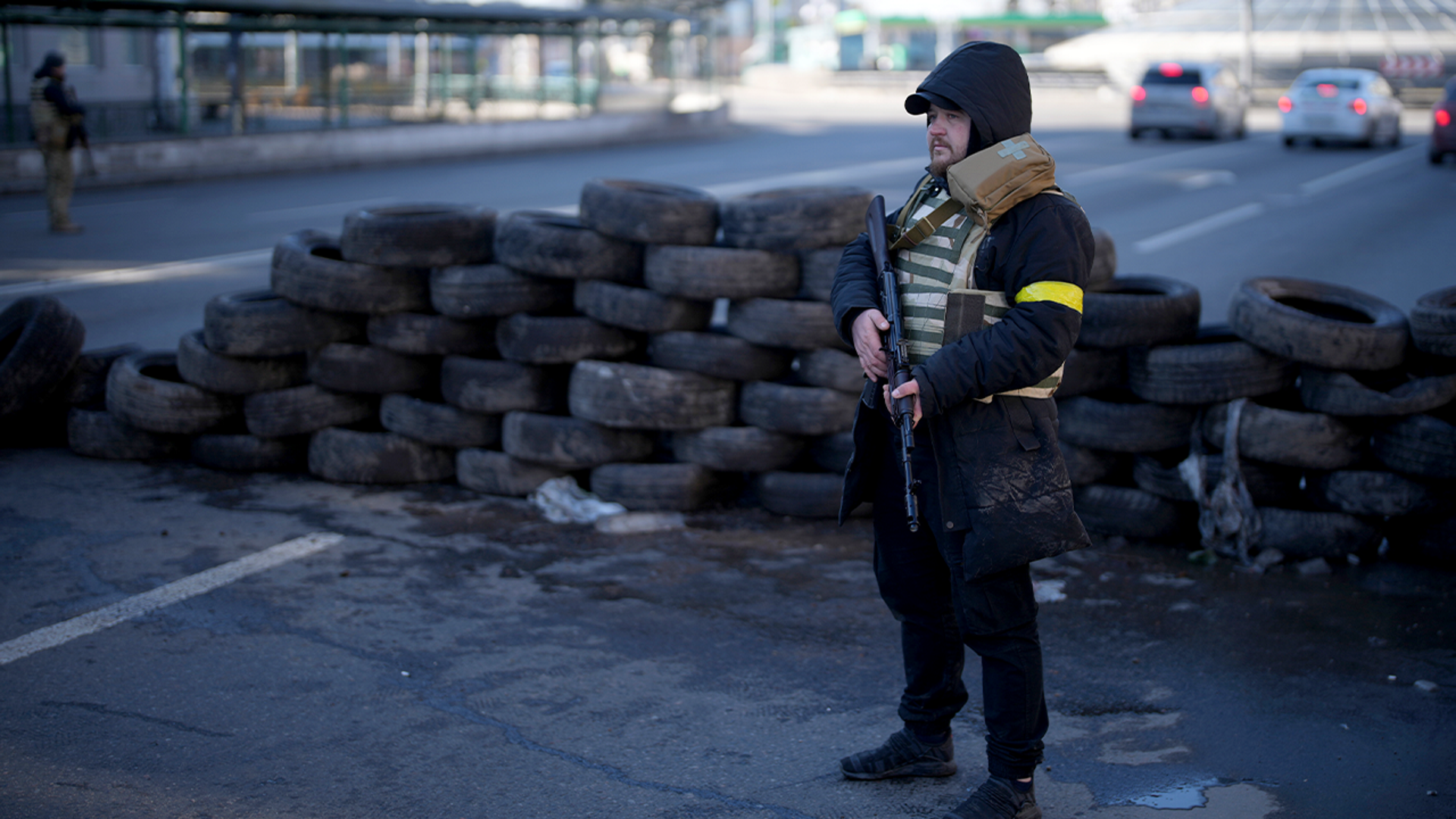 Civil defense personnel man a checkpoint in Kyiv, Ukraine, Saturday, Feb. 26, 2022.