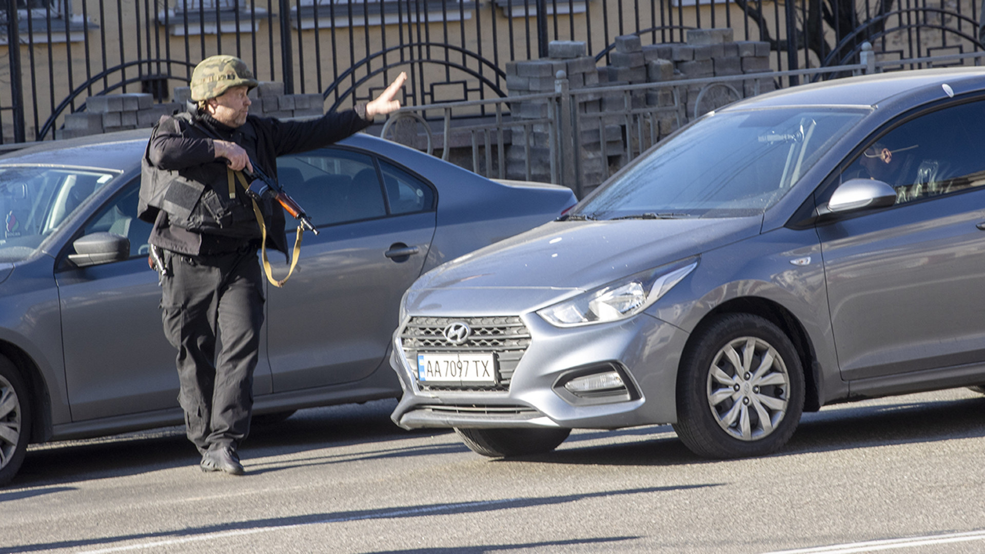 A soldier checks vehicles in Zhuliany neighborhood of Kyiv during Russia's invasion of Ukraine, on February 26, 2022.