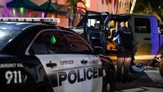 Florida man allegedly found choking wife shot dead by police, officials say