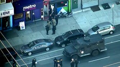 Philadelphia SWAT officer shot in bulletproof vest, suspect in custody, police say