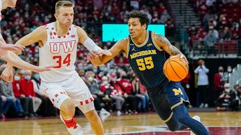 Michigan coach Juwan Howard appears to throw punch at Wisconsin assistant, brawl breaks out between players