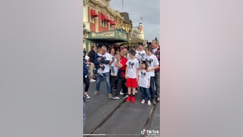 Grandmother surprised at Disney's Magic Kingdom by family for her 70th birthday