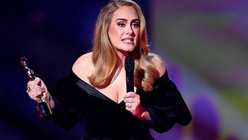 Adele criticized over Brits award speech after saying she loves 'being a woman'