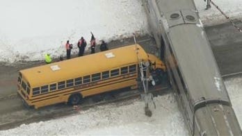 Illinois school bus driver hailed as hero for getting kids off stalled bus before train struck