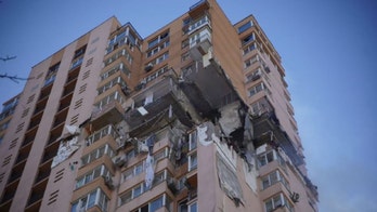 Kyiv high-rise apartment building hit by missile strike
