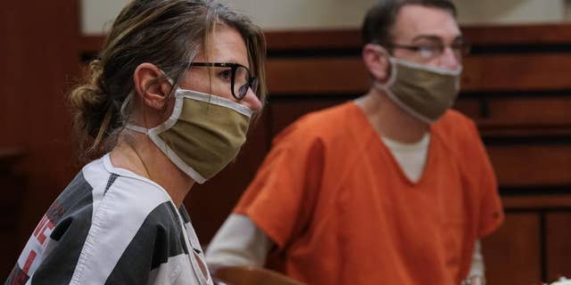 Jennifer and James Crumbley, the parents of Ethan Crumbley, a teenager accused of killing four students in a shooting at Oxford High School, appear in court for a preliminary examination on involuntary manslaughter charges in Rochester Hills, Mich., Tuesday, Feb. 8, 2022.