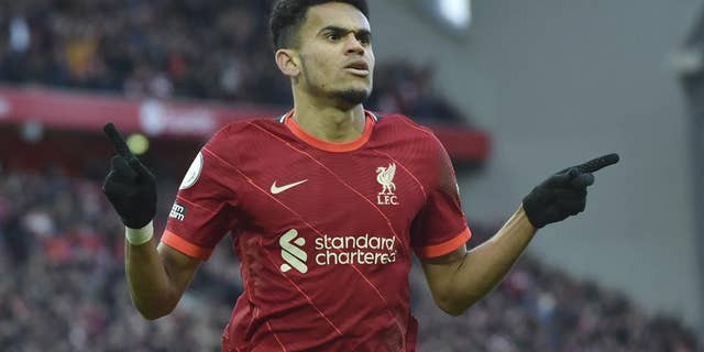 Liverpool's Luis Diaz celebrates after scoring his sides 3rd goal during the English Premier League soccer match between Liverpool and Norwich City and at Anfield stadium in Liverpool, England, Saturday, Feb. 19, 2022.