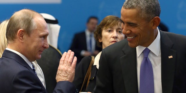 U.S. President Barack Obama (R) chats with Russia's President Vladimir Putin prior to a working session at the Group of 20 (G20) leaders summit in the Mediterranean resort city of Antalya, Turkey, November 16, 2015.