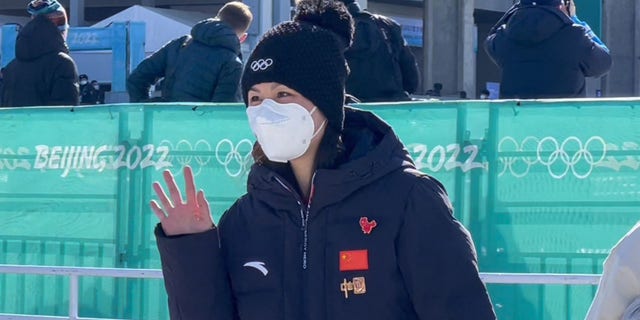 IOC's Thomas Bach says 'Where is Peng Shuai?' questions have been answered after Olympic appearances 4 China's Peng Shuai waves as she leaves the event.