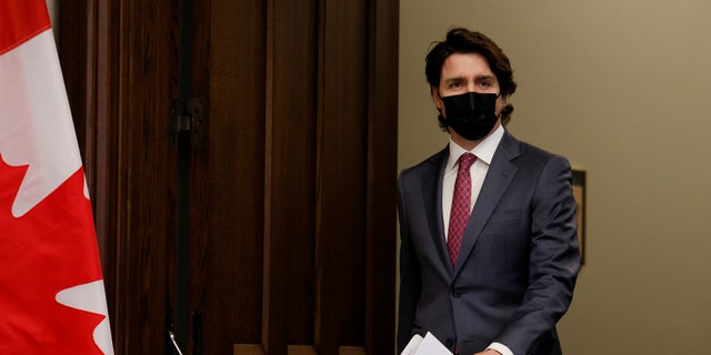 Canada Prime Minister Justin Trudeau arrives to a news conference on Parliament Hill in Ottawa, Ontario, Canada, Feb, 14, 2022. 