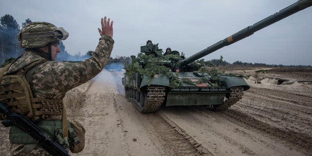 Ukrainian service members take part in tactical drills at a training ground in an unknown location in Ukraine, in this handout picture released February 22, 2022. Press service of the Ukrainian Armed Forces General Staff/Handout via REUTERS ATTENTION EDITORS - THIS IMAGE HAS BEEN SUPPLIED BY A THIRD PARTY.