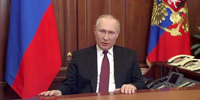 Russian President Vladimir Putin delivers a video address announcing the start of the military operation in eastern Ukraine, in Moscow, Russia, in a still image taken from video footage released February 24, 2022.