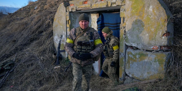 Kiev, Texas-born Ukrainian exchange student with family at home: 'I would like to help them somehow' - Reuters 3 Ukrainian soldiers take position at the Vasylkiv military air base in the Kiev region, Ukraine, on February 26, 2022.