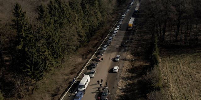 A screenshot of drone footage shows cars forming a line that stretches about 35 km from the Shehyni border crossing to Poland as people try to flee the Russian military operation against Ukraine, in outside Mostyska, Ukraine on February 26, 2022.