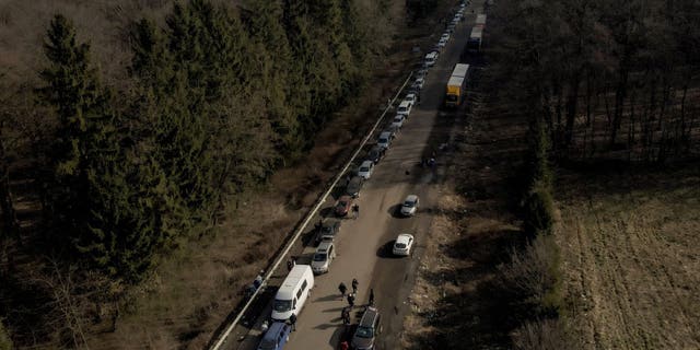 Kiev, Texas-born Ukrainian exchange student with family at home: 'I would like to help them somehow' - Reuters 4 A screenshot of drone footage shows cars forming a line that stretches about 35 km from the Shehyni border crossing to Poland as people try to flee the Russian military operation against Ukraine, in outside Mostyska, Ukraine on February 26, 2022.