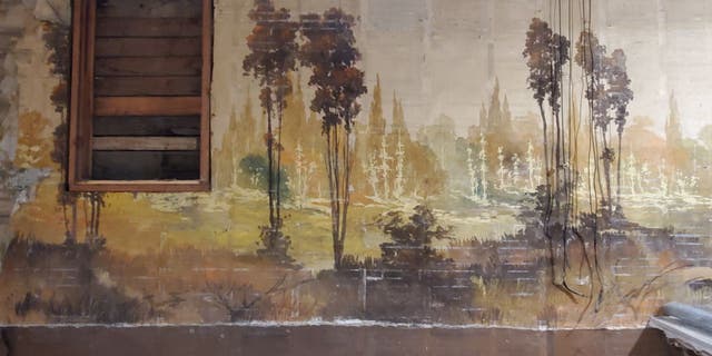 The two landscape murals on the building’s north- and south-facing walls measure about 20 feet in height and 60 feet in length.