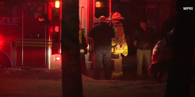 Emergency responders gather outside Genesis Healthcare's Respiratory and Rehabilitation Center in Coventry, Rhode Island, Feb. 3, 2021.