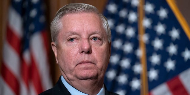 Sen. Lindsey Graham, R-S.C., the ranking member of the Senate Budget Committee, waits to speak to reporters following bi-partisan passage of the Ending Forced Arbitration of Sexual Assault and Sexual Harassment Act, at the Capitol in Washington, Feb. 10, 2022. 