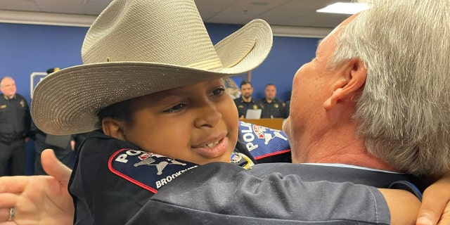 Devarjaye "D.J." Daniel, 10, is sworn into his 100th law enforcement agency. (Montgomery County Judge Mark Keough)