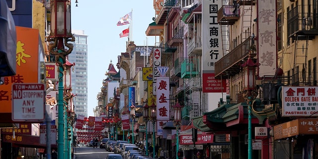 A person crosses Grant Avenue in Chinatown in San Francisco, Thursday, March 25, 2021.