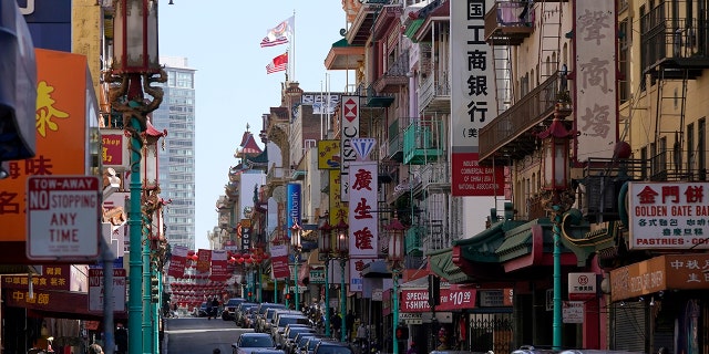 A person crosses Grant Avenue in Chinatown in San Francisco, Thursday, March 25, 2021.