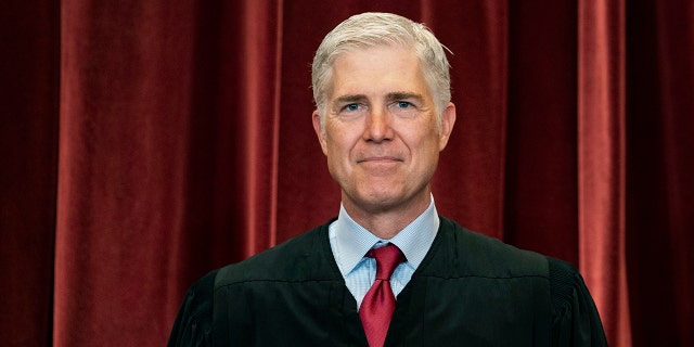 Associate Justice Neil Gorsuch stands during a group photo at the Supreme Court in Washington, April 23, 2021. (Associated Press)