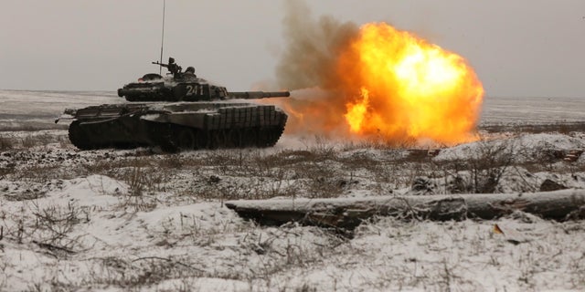 A Russian T-72B3 tank fires as troops take part in drills at the Kadamovskiy firing range in the Rostov region in southern Russia, Wednesday, Jan. 12, 2022. 