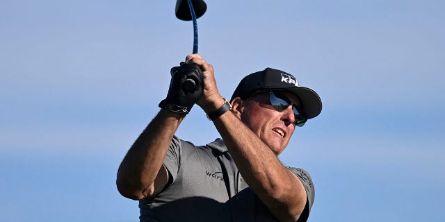 Phil Mickelson hits his tee shot on the fifth hole of the South Course at Torrey Pines during the first round of the Farmers Insurance Open golf tournament Jan. 26, 2022, in San Diego.