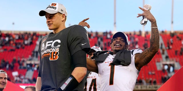 Cincinnati Bengals quarterback Joe Burrow, left, and wide receiver Ja'Marr Chase (1) celebrate after the AFC championship game against the Kansas City Chiefs Jan. 30, 2022, in Kansas City, Mo. The Bengals won 27-24 in overtime.