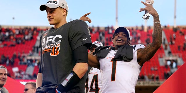 Cincinnati Bengals quarterback Joe Burrow, left, and wide receiver Ja'Marr Chase (1) celebrate after the AFC championship NFL football game against the Kansas City Chiefs, Sunday, Jan. 30, 2022, in Kansas City, Mo. The Bengals won 27-24 in overtime.