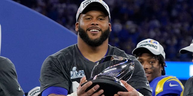 Aaron Donald of the Los Angeles Rams holds the George Halas Trophy after the NFC Championship NFL football game against the San Francisco 49ers on Sunday January 30, 2022 in Inglewood, California. The Rams won 20-17 to qualify for the Super Bowl.