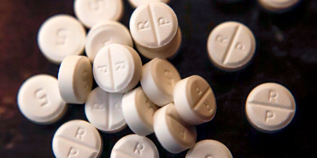 This June 17, 2019, file photo shows 5-mg pills of Oxycodone. Native American tribes in the U.S. have reached settlements worth $590 million over opioids.