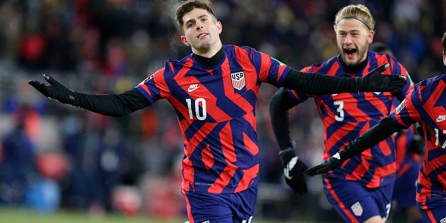 The United States' Christian Pulisic (10) celebrates a goal with Walker Zimmerman (3) during the team's FIFA World Cup qualifying soccer match against Honduras Feb. 2, 2022, in St. Paul, Minn.