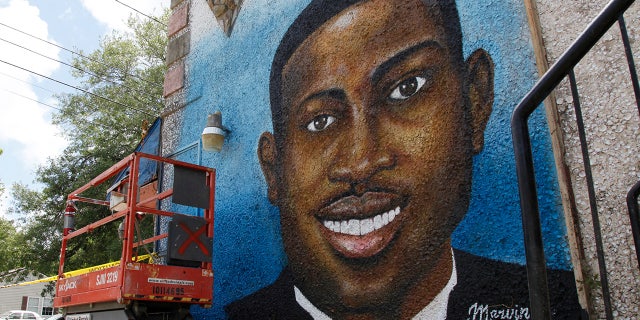 This May 17, 2020, file photo, shows a mural depicting Ahmaud Arbery in Brunswick, Georgia. (AP Photo/Sarah Blake Morgan, File)