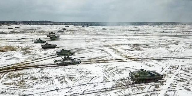 Tanks move during the Belarusian and Russian joint military drills at Brestsky firing range in Belarus on Feb. 4, 2022.
