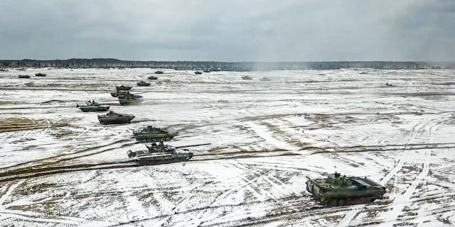 Tanks move during the Belarusian and Russian joint military drills at Brestsky firing range in Belarus on Feb. 4, 2022.