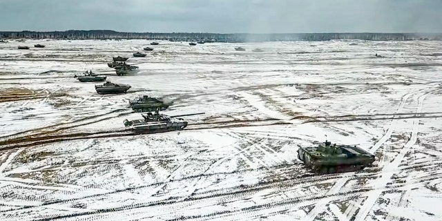 In this photo taken from video and released by the Russian Defense Ministry Press Service on Friday, Feb. 4, 2022, tanks move during the Belarusian and Russian joint military drills at Brestsky firing range, Belarus.
